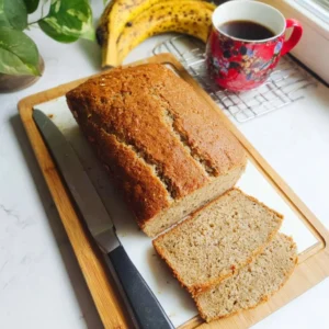 Slices of 100% millet banana bread on a wooden board