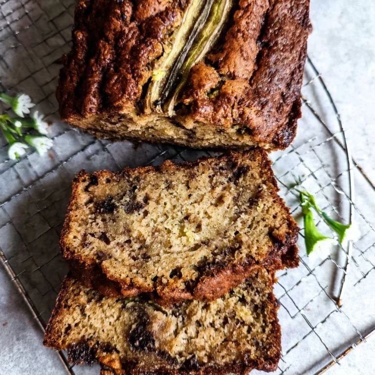 Delicious vegan zucchini banana bread on a wooden table