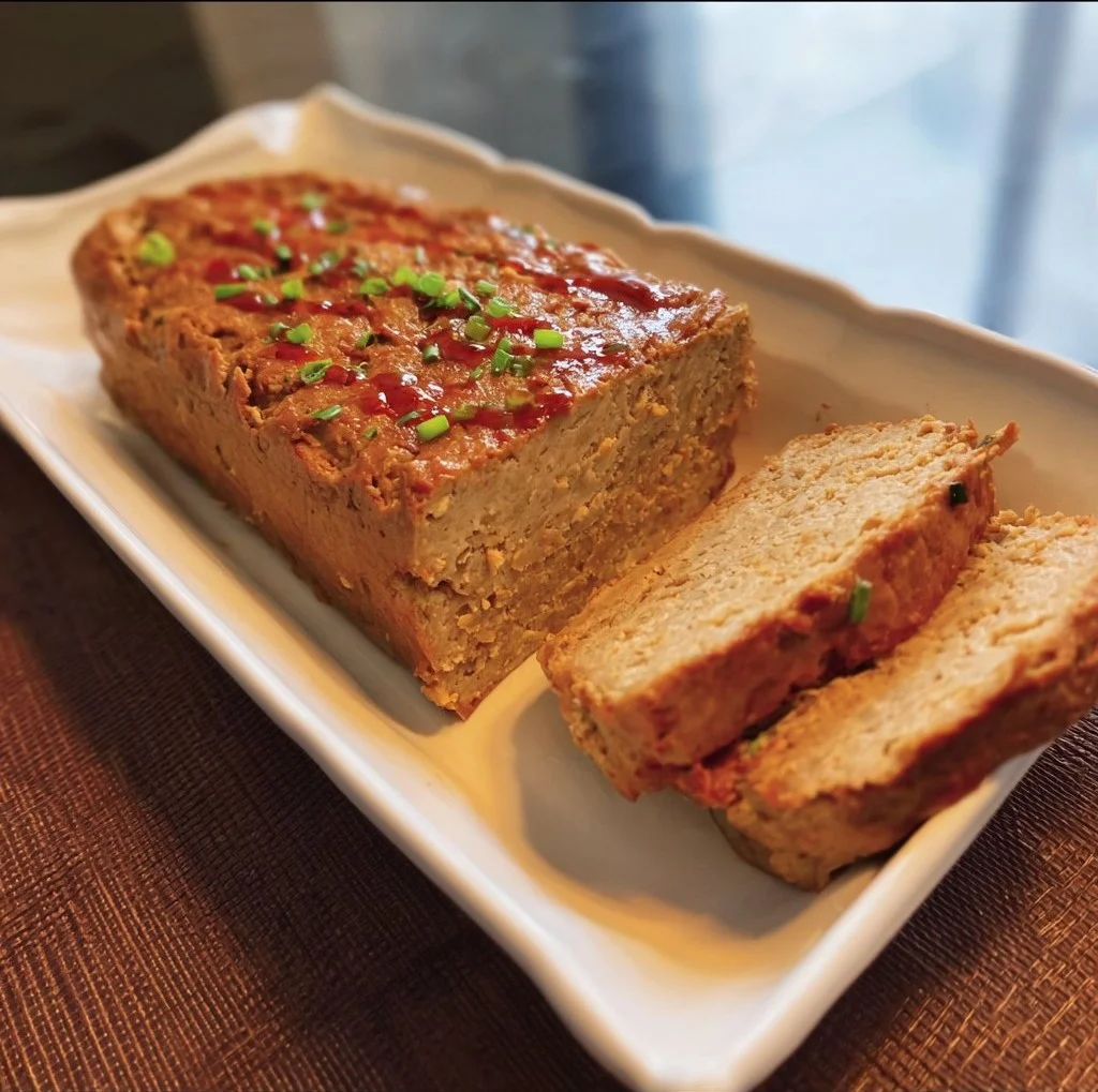 Delicious Classic Tofu Loaf served on a rustic wooden table.