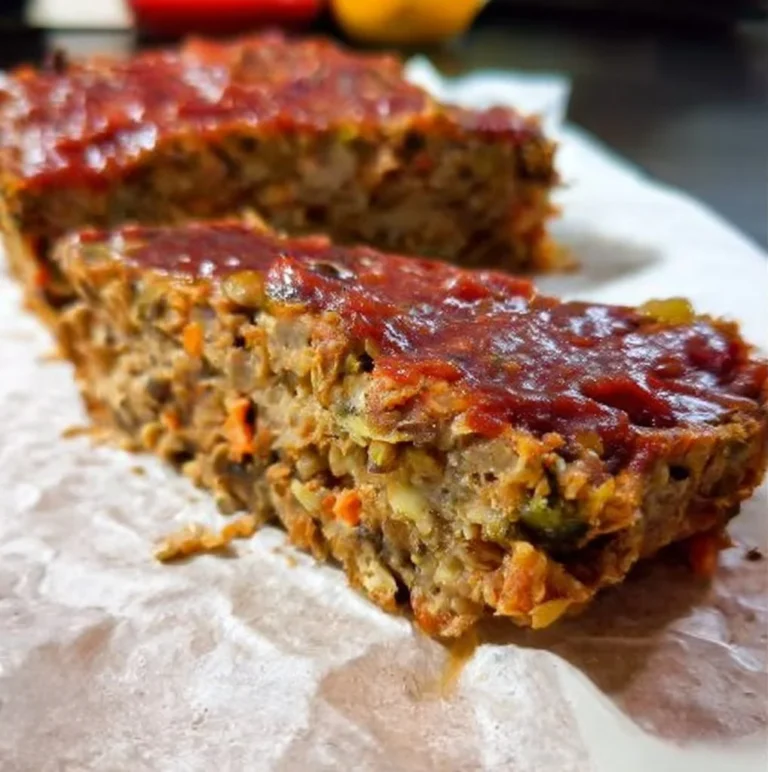 Delicious Lentil and Oat Vegan Meatloaf served with fresh vegetables.