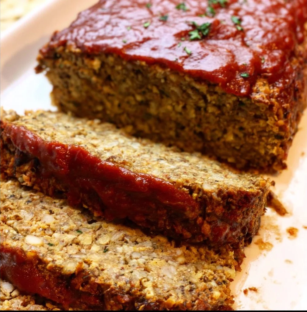 Delicious Vegan Cauliflower Lentil Loaf served with vegetables
